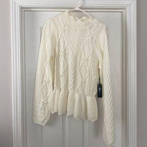 Never worn with tags. Peplum white turtleneck